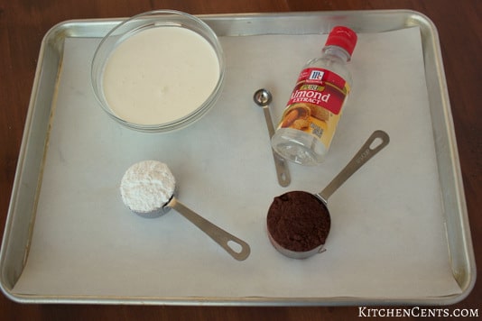 Ingredients heavy cream, powdered sugar, cocoa powder and almond extract which is optional for the recipe.