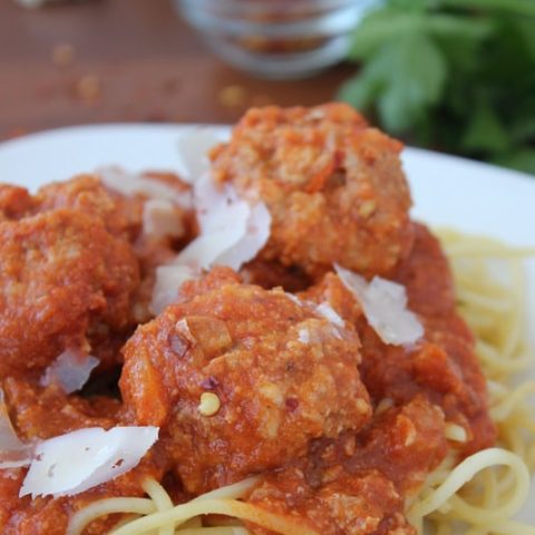 Turkey Meatballs on top a bed of spaghetti noodles.