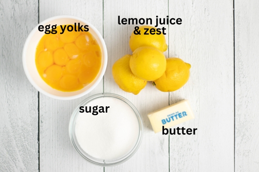 Image with all ingredients needed to make homemade lemon curd.