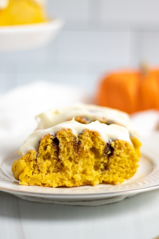 Cut in half, pumpkin roll with cream cheese frosting