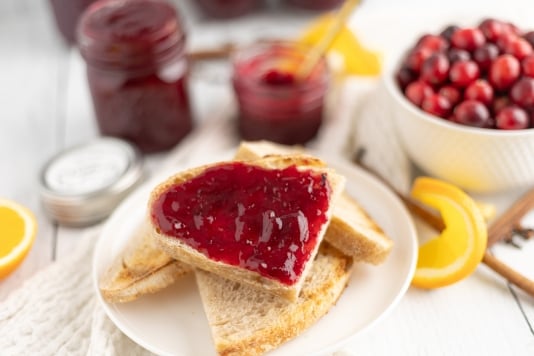 A piece of sourdough toast topped with Christmas jam.